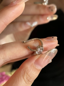 Detailed view of silver star ear cuff with sparkling geometric zircon for non-pierced ears