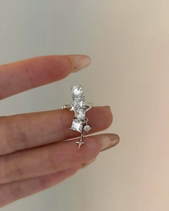 Detail shot of a silver star ear cuff featuring geometric sparkling zircons.