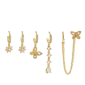 Detailed view of 5-piece gold butterfly and flower earring set with sparkling zircons