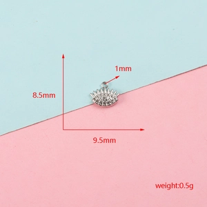 Macro view of a small stainless steel eye pendant with clear zircon stones and measurements
