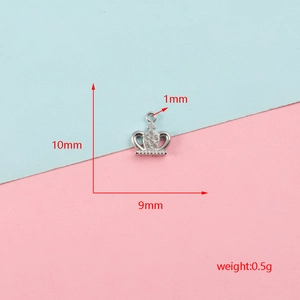 Detailed silver crown necklace pendant with 10mm height, 9mm width, and 0.5g weight