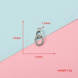 Close-up detail view of silver stainless steel oval pendant base with size dimensions