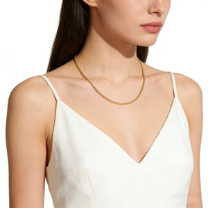 Elegant 18K gold plated stainless steel wheat chain necklace worn by a female model