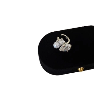 Sparkling zircon and pearl ear cuff for non-pierced ears, elegant gold-toned design