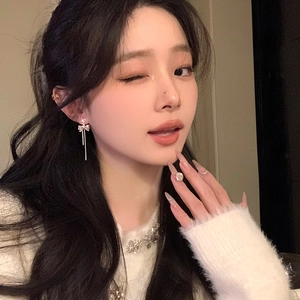 Elegant silver bow-knot tassel earrings with sparkling heart-shaped zircons