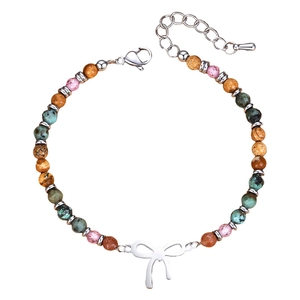 Detailed view of 4mm natural stone beaded bracelet with polished silver bow charm