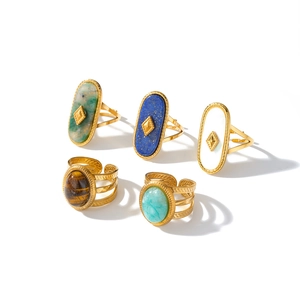 Set of vintage stainless steel rings with natural stones in an adjustable gold band