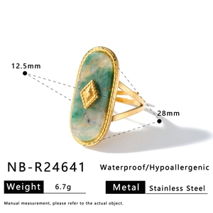 Macro detail of vintage gold stainless steel ring with green stone inlay and dimensions