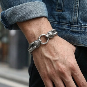 Detail shot of vintage silver steel men's bracelet with double rabbit head design