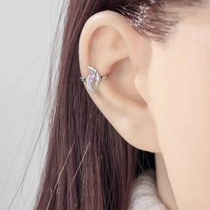 Silver angel wing ear cuff featuring a pink heart zircon displayed on a model's ear