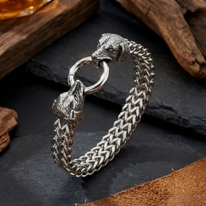 Men's stainless steel bracelet featuring dual wolf heads and woven wheat chain link