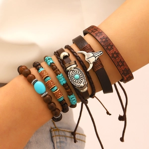 Detail of bohemian multilayer bracelet featuring leather, wood beads, and turquoise accents