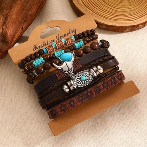 Close-up of bohemian multi-layer bracelet with turquoise beads and bull head pendant