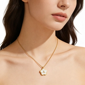 Gold stainless steel 18K necklace with a white clover shell pendant and letter A charm