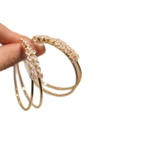 Elegant double-layer gold hoop clip-on earrings with shimmering zircons for women.