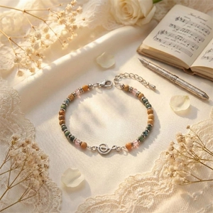 Detail view of beaded music note bracelet with African turquoise and crystal stones