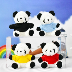 Four adorable mini panda plush keychains wearing colorful shirts on a clear display stand