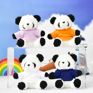 Four panda plush keychains wearing lavender, orange, white, and navy t-shirts on display