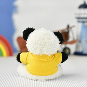 Detailed back view of a cute panda plush toy keychain wearing a bright yellow shirt