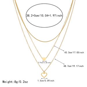 Detailed size chart for gold triple layered necklace with heart pendants and 8g weight
