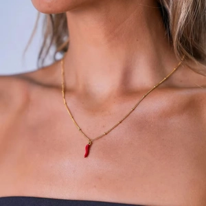 18K gold plated bead chain necklace with red enamel chili pepper pendant on female model