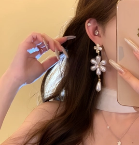 Elegant long drop earrings featuring a zircon flower design and a polished teardrop pearl pendant