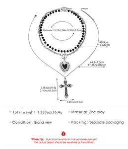 Detailed view of layered gothic cross and heart necklace with sizing specifications