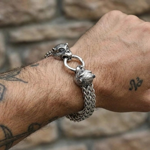 Detail of vintage silver braided steel chain bracelet with monkey head charms for men