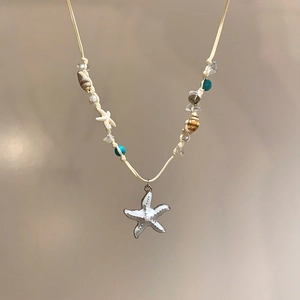 Detailed view of beach-themed starfish and shell beaded choker necklace