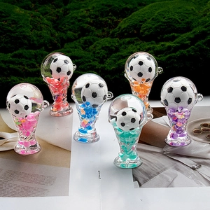 Detailed set of six soccer trophy acrylic liquid keychains with colorful flowing stars