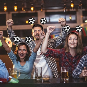 Glittering black and white football headbands for soccer fans in a festive pub setting