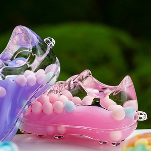 Macro detail of acrylic sneaker keychains with colorful macaron sand liquid inside