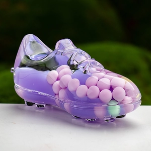 Macro shot of purple translucent sneaker keychain filled with pastel liquid beads