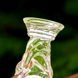 Macro shot of iridescent acrylic liquid sand keychain with spiral trophy design