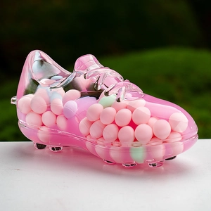 Detail of pink acrylic soccer shoe keychain with moving liquid sand and pastel beads