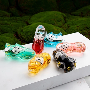 Close-up of colorful acrylic soccer shoe liquid keychains with miniature footballs inside