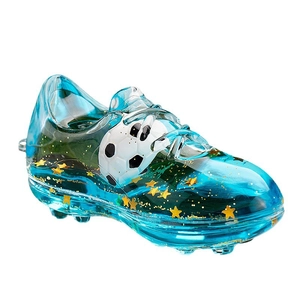Blue acrylic football shoe keychain with floating soccer ball and gold star sequins