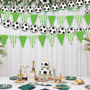 Detail of soccer themed birthday banner and striped pennants for cake party decoration