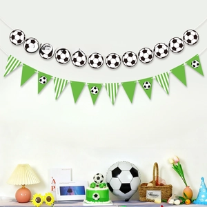 Detail of soccer theme party bunting with football patterns and green triangle flags