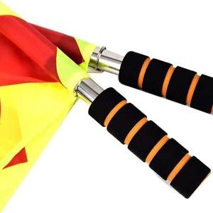 Sports referee flags with foam handles and vibrant red yellow fabric on steel poles