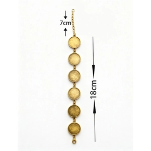 Antique gold bracelet with 6 round bezel trays and lobster clasp on white background