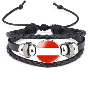 Detail of adjustable black leather braided bracelet with Austria flag glass charm