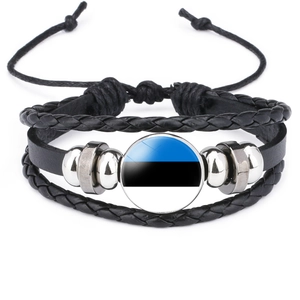 Macro detail of multilayer black leather bracelet with Estonia flag glass charm