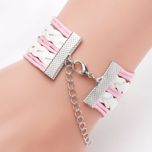 Close-up of pink and white woven leather Palestine flag bracelet with adjustable clasp