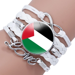 Detailed shot of multi-layer woven leather Palestine flag bracelet with Love charm