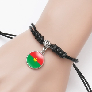 Adjustable black cord bracelet featuring a glass dome Burkina Faso flag pendant charm