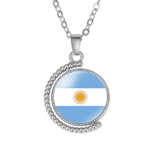Detailed view of rotating crescent pendant with Argentina flag and polished silver finish