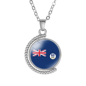 Macro shot of silver alloy spinning moon necklace featuring the Falkland Islands flag