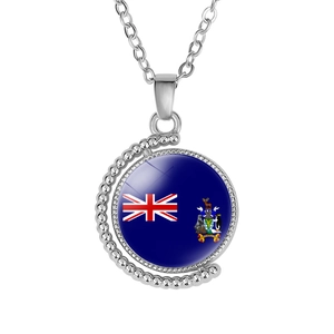 Close-up of rotatable silver moon necklace with South Georgia flag pattern pendant