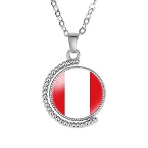 Detailed macro view of Peru flag pendant necklace with rotating crescent alloy frame